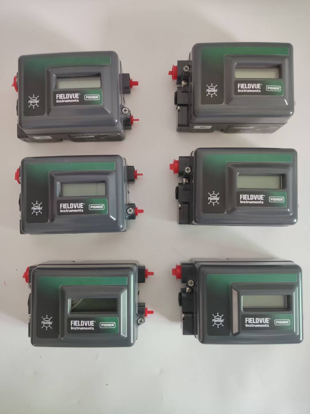 Six Fisher FIELDVUE DVC2000 digital valve positioners with LCD displays and local buttons. Compact design for easy calibration without HART communicator. Genuine Fisher instruments in stock at YUNRUI Controls.